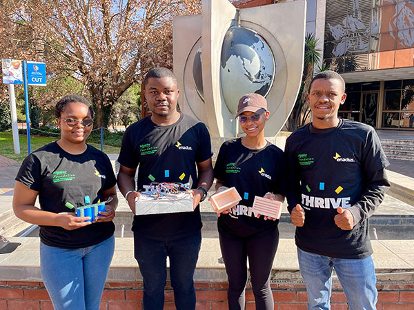 Team members showcasing innovative battery products