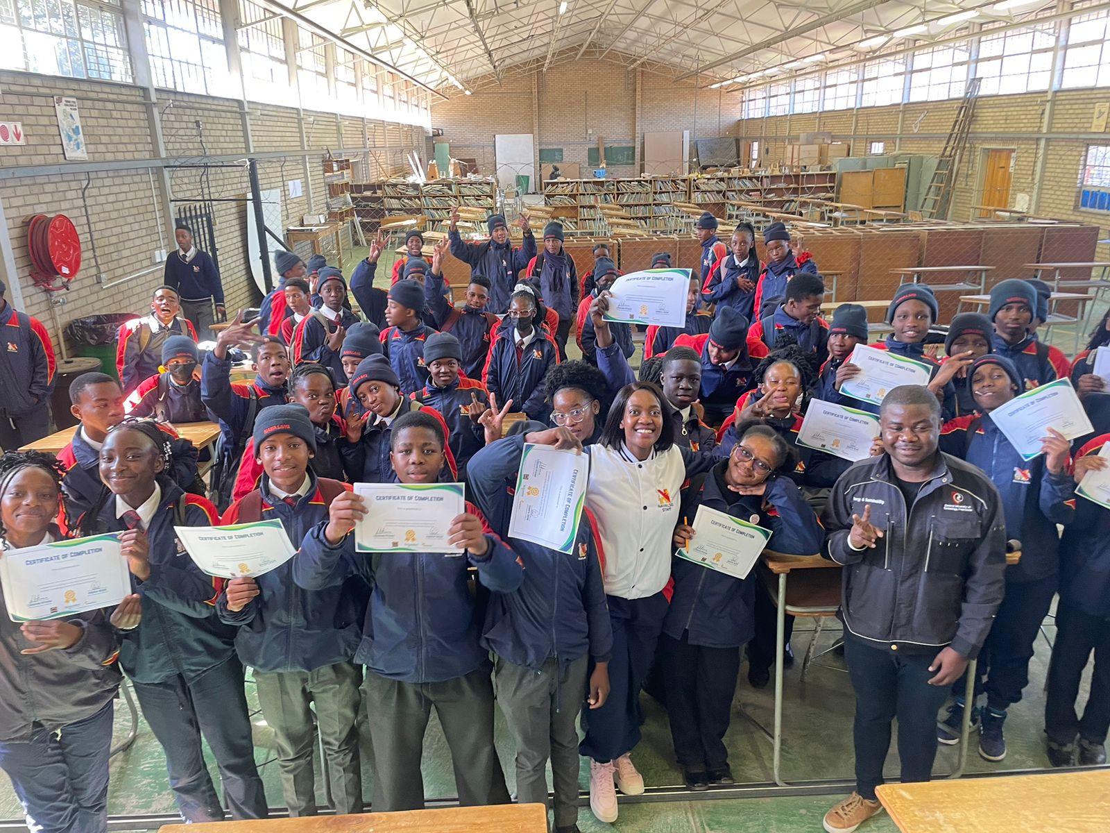 Students celebrating with their certificates of completion